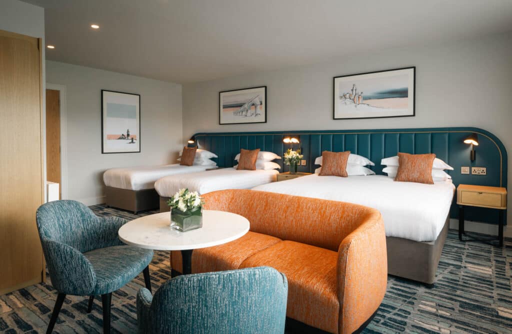 Viking Hotel Waterford Superior Room with two doubles, single bed and seating area